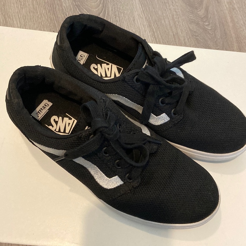 Black vans with white sole